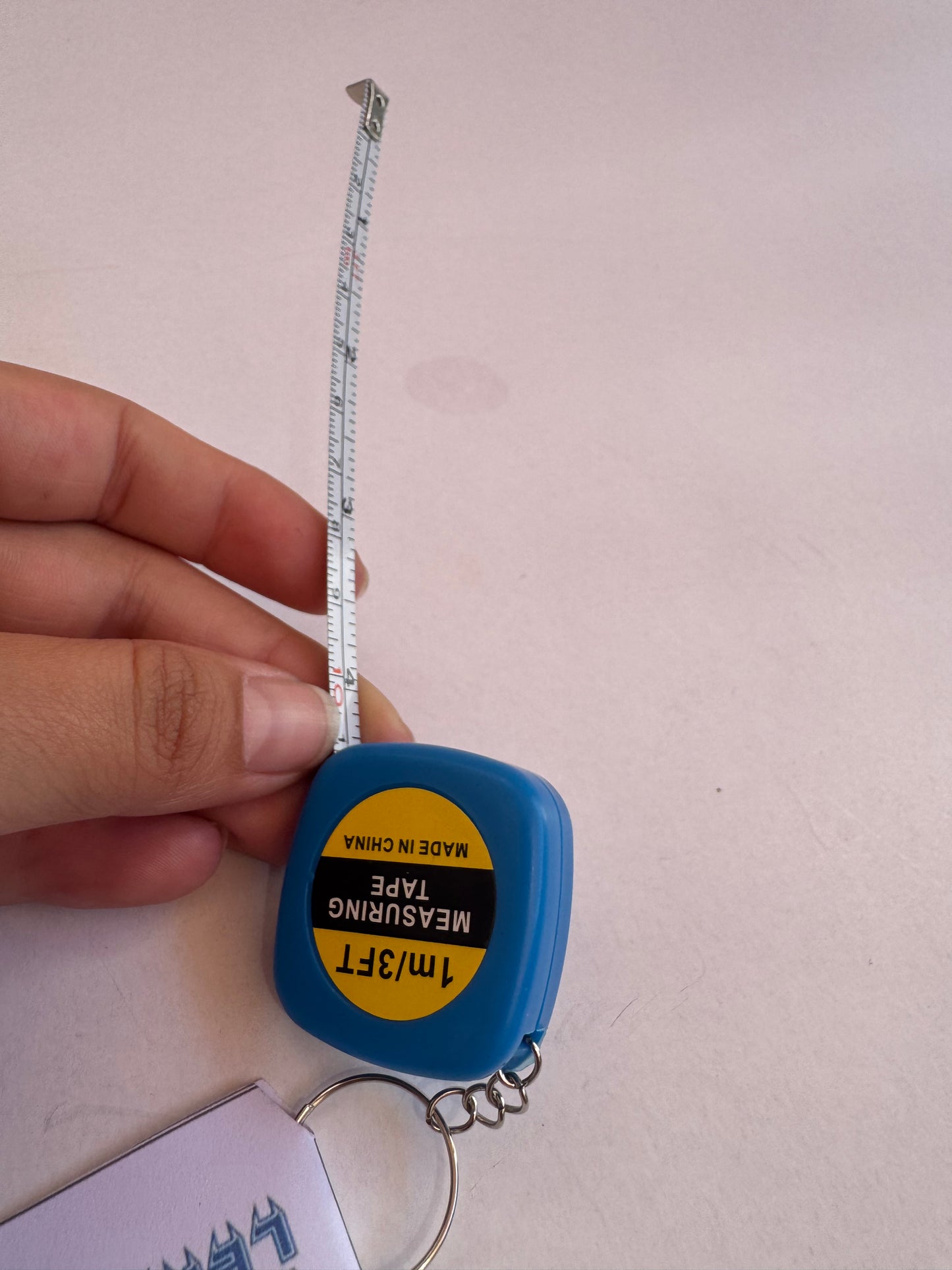 Llavero cinta métrica